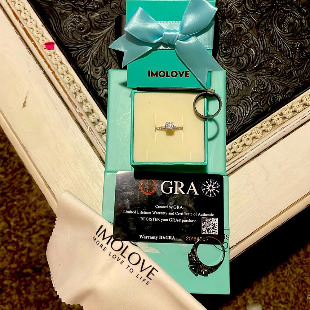 engagement ring, it comes with a box, ring sizer, ring cleaner.